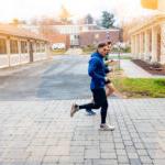 Trinity college student athletes running through campus